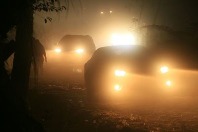 Illuminated car at sunset