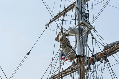 Low angle view of mast against blue sky