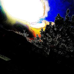 Low angle view of rainbow against sky at night