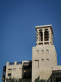 Low angle view of building against blue sky