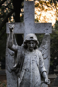 Close-up of statue in cemetery