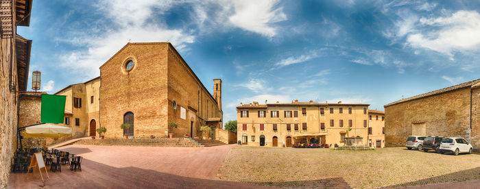 Buildings in city against sky