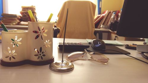 Close-up of electric lamp on table