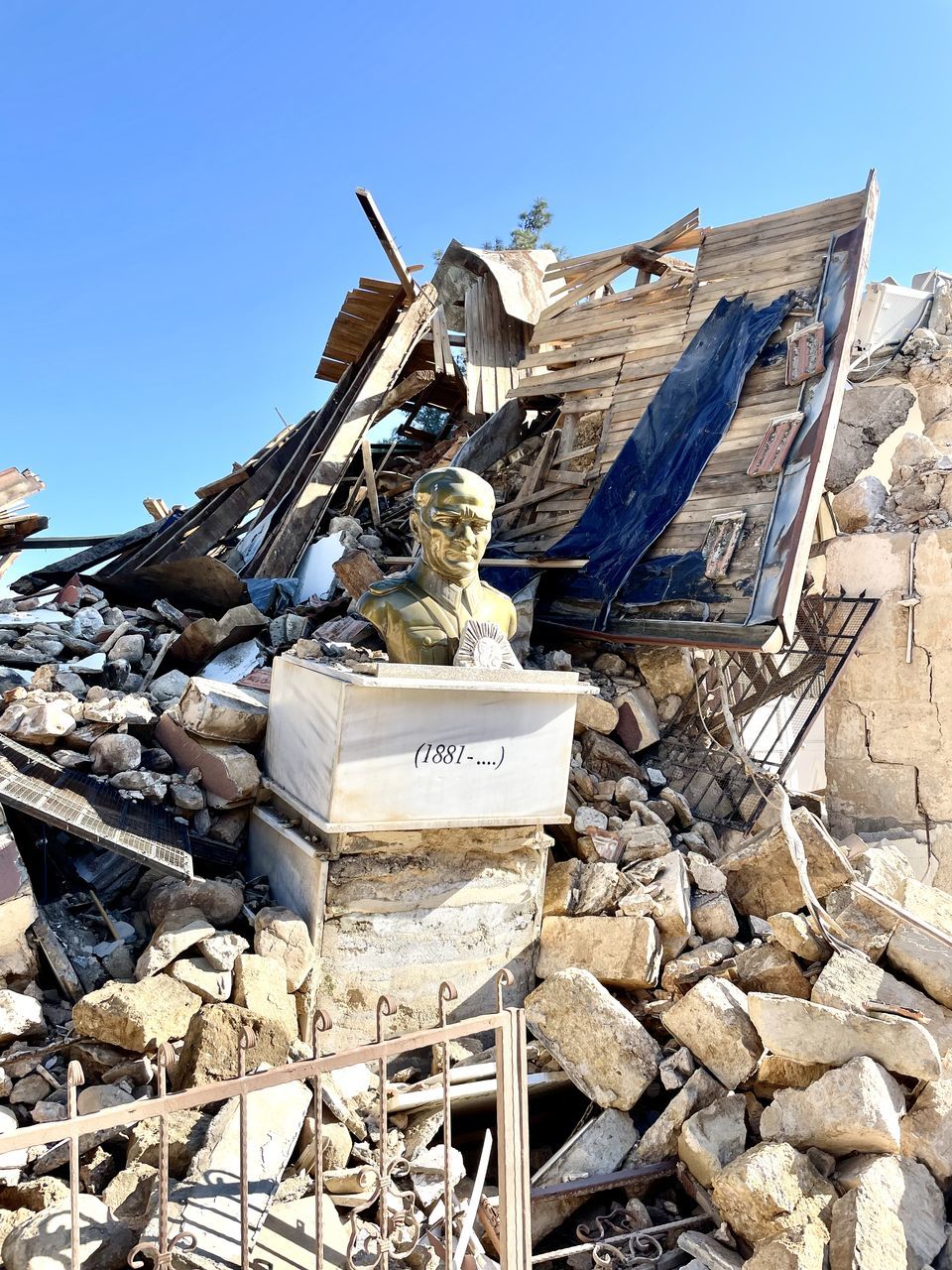 earthquake, nature, sky, day, demolition, rubble, no people, architecture, clear sky, scrap, damaged, blue, outdoors, ruined, sunlight, abandoned, large group of objects, sunny, heap
