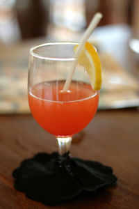 Close-up of juice glass on table