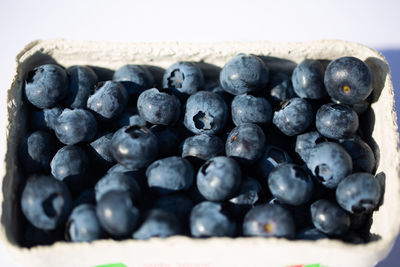 Close-up of blackberries in container on table