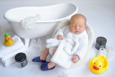 High angle view of cute baby boy in bathtub