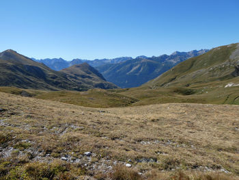 Panoramic alpine landscape against clear blue sky near colle del preit