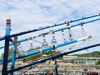 Low angle view of cables against sky