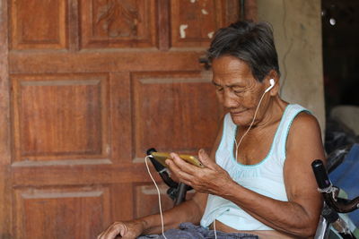 Young woman using mobile phone outdoors