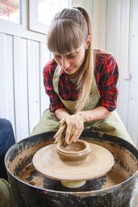 Woman working at pottery