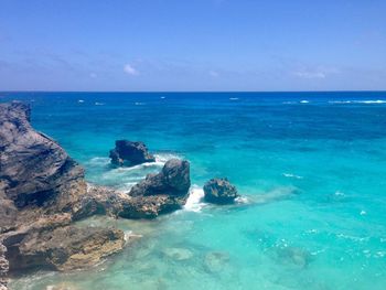 Scenic view of sea against blue sky