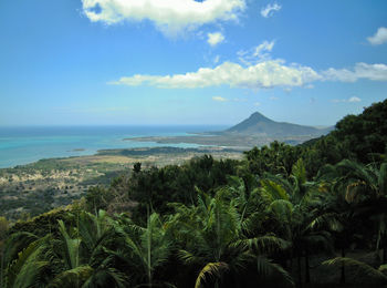 Scenic view of the island of mauritus with a blue sea against sky