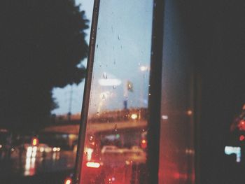 Wet glass window at night