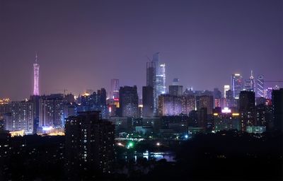 View of skyscrapers lit up at night