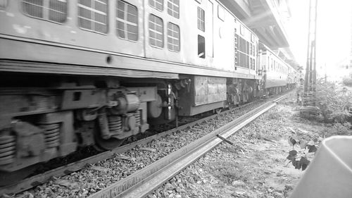 Train on railroad tracks against sky