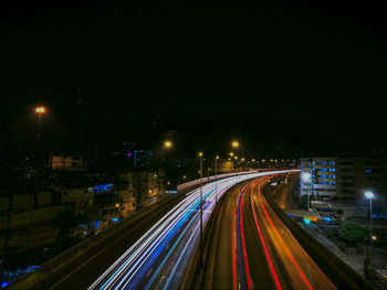 High angle view of light trails on road at night