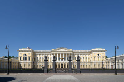 Facade of building against blue sky