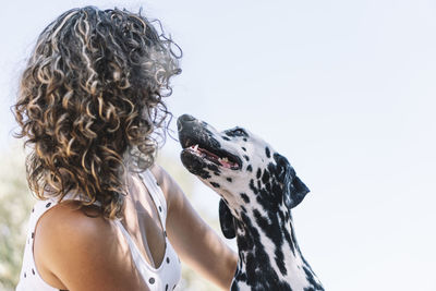 Rear view of woman with dog