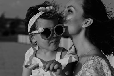 Close-up of young woman wearing sunglasses