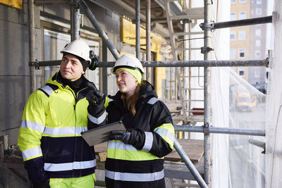 Engineers talking at building site