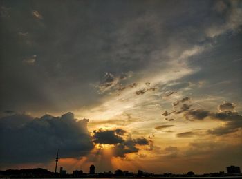 Low angle view of dramatic sky during sunset