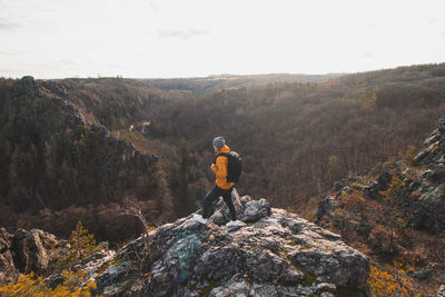 Rear view of man walking on mountain