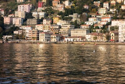 View of sea and buildings in town