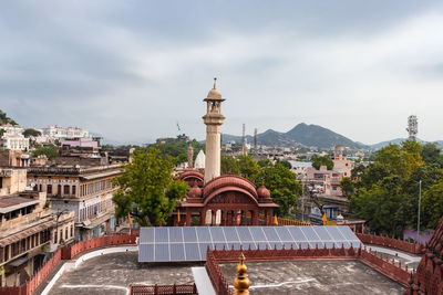 Ancient holy jain trample entrance with cloudy sky and mountain background