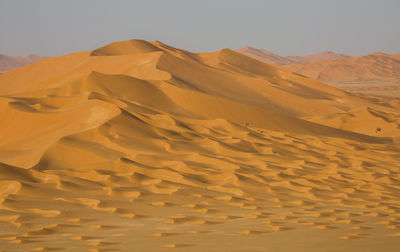 Scenic view of desert against clear sky