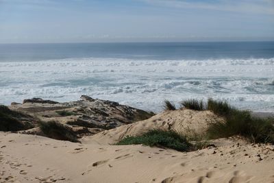 Scenic view of beach against sky