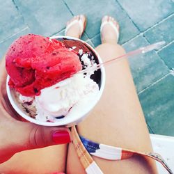 Close-up of hand holding ice cream