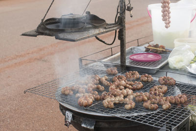 High angle view of meat on barbecue grill