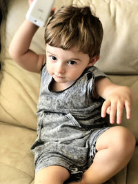 Portrait of cute girl sitting at home