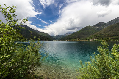 Scenic view of lake and mountains against sky