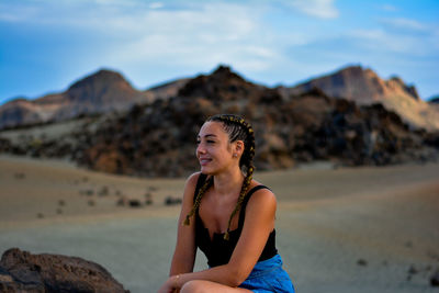 Portrait of smiling young woman on beach