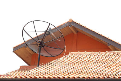 Low angle view of roof and building against sky