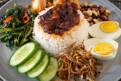 Nasi lemak is a malay fragrant rice dish cooked in coconut milk and pandan leaf.