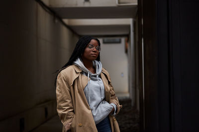 Portrait of young woman looking at camera