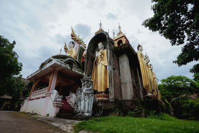 Low angle view of statue against sky
