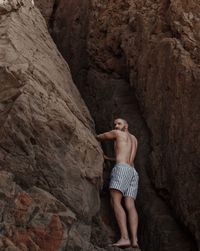 Woman standing on rock