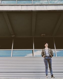 Full length of child standing on building