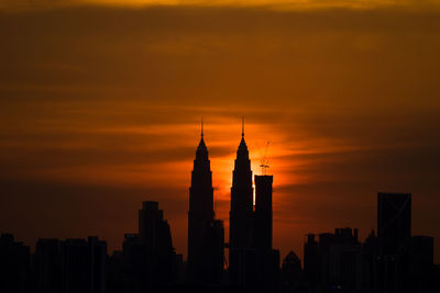 Silhouette of skyscrapers at sunset