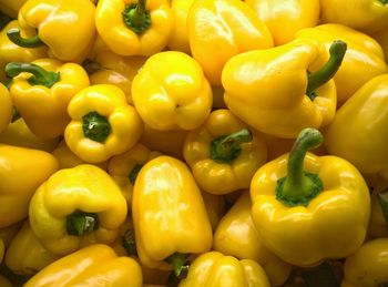 Full frame shot of yellow bell peppers at market