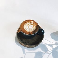 Coffee cup with text on white background