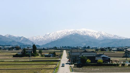 Scenic view of snowcapped mountains against clear sky