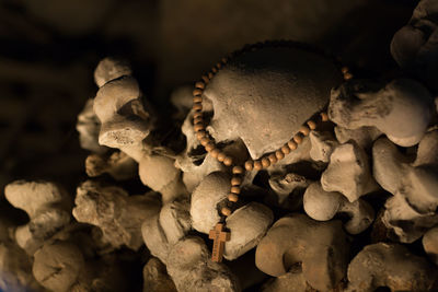 Close-up of rosary beads on skull