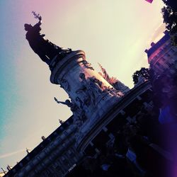 Low angle view of sculpture against sky during sunset