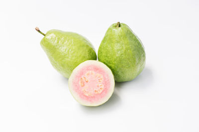 Close-up of fruits against white background