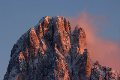 Low angle view of rock formation against sky during sunset